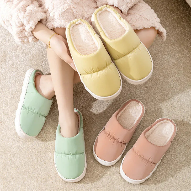 Blue thick-soled indoor slippers with artificial leather upper and plush lining on a rubber sole.