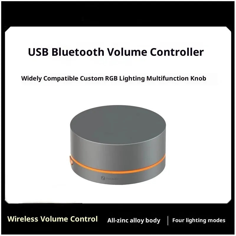 Black VOL20 USB volume controller on desk with rotary knob and cable