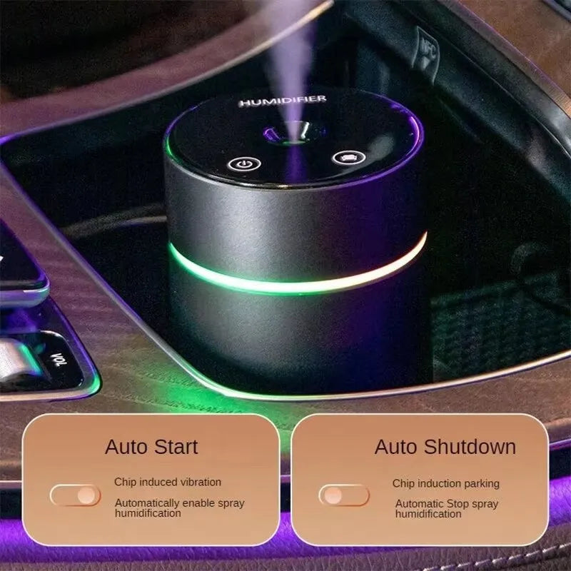 Compact aluminium car air humidifier and essential oil diffuser with night light on wooden desk