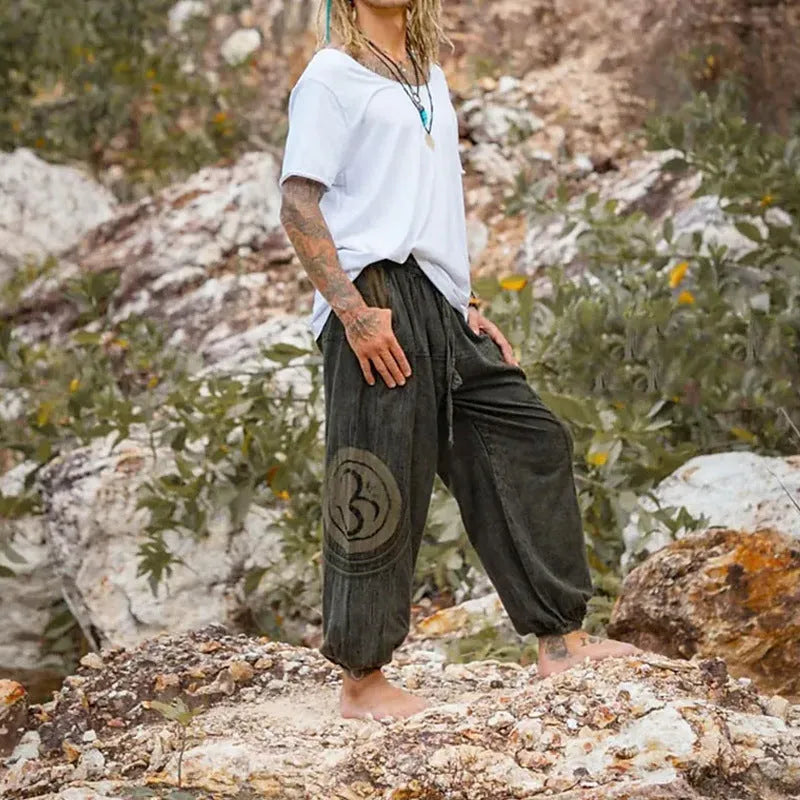 Dark green men's casual trousers with ethnic pattern and ankle-tied closure