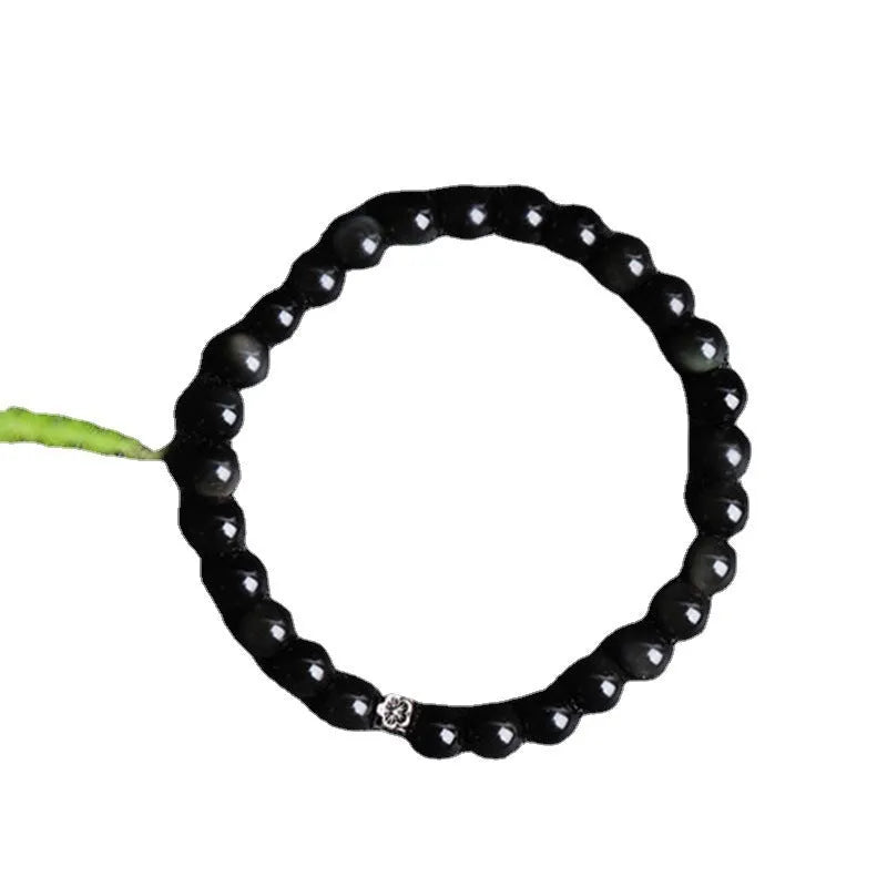 Natural obsidian bracelet with S925 silver flower accessories showing 6mm constellation design and dragon phoenix decorations