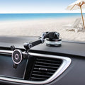 Gravity magnetic car phone holder with suction cup and adjustable arm mounted on dashboard