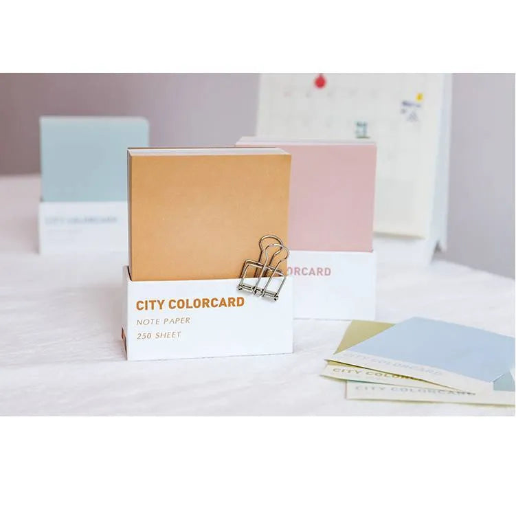 Set of four rectangular 75x95mm paper memo notes with different cityscape designs, showing no adhesive backing.