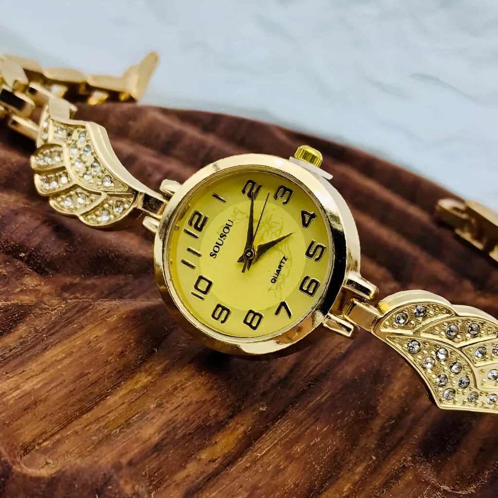 Women's stainless steel watch with a round dial shown in gold, golden white, and black/gold surface options.