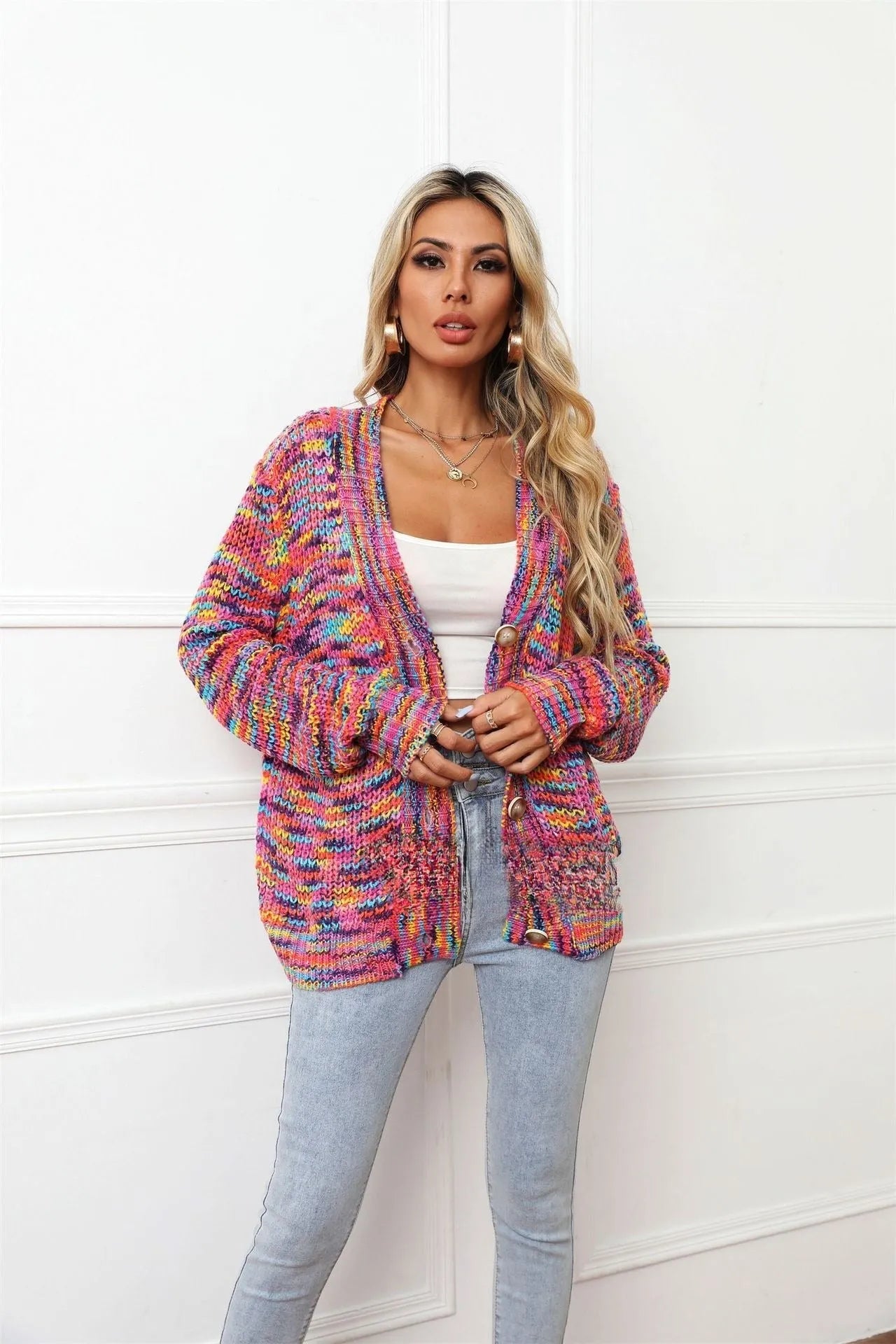 Rose red women's short cardigan with rainbow festival stripes, loose fit, worn open as a coat.
