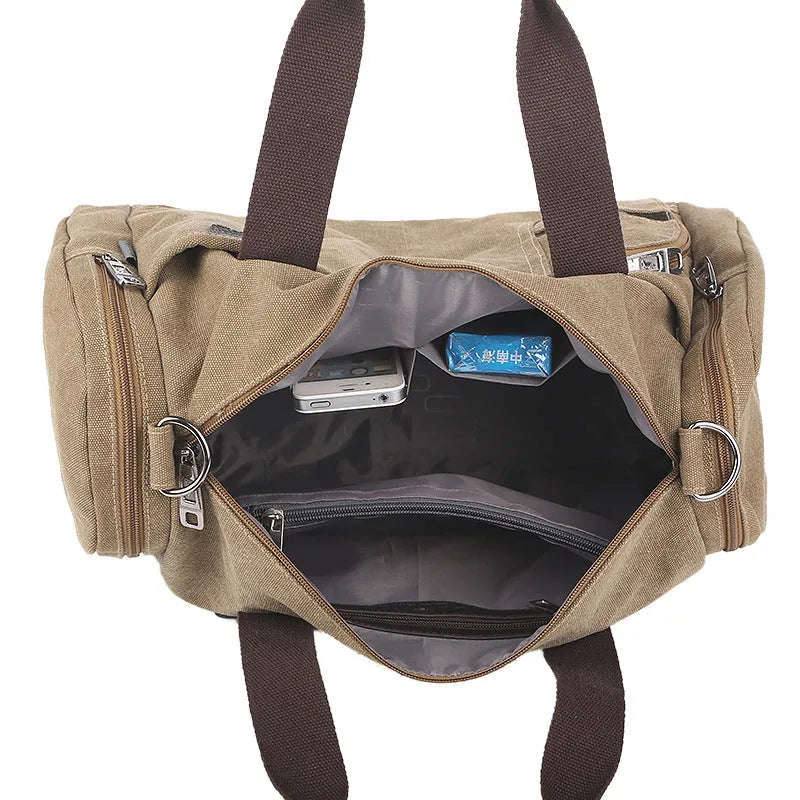 Horizontal square canvas shoulder bag with zipper closure and multiple pockets in khaki colour
