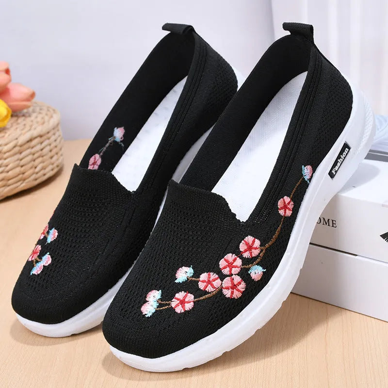 Women's embroidered woven casual pump in wine red with a low heel and anti-slip sole.