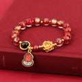 Gold foil Lotus Blessing card charm on a fragrant glazed 8mm bead bracelet for women.