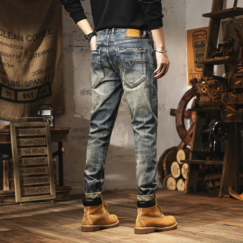 Men's vintage blue loose straight-leg jeans with fleece lining and a drawstring waist closure.