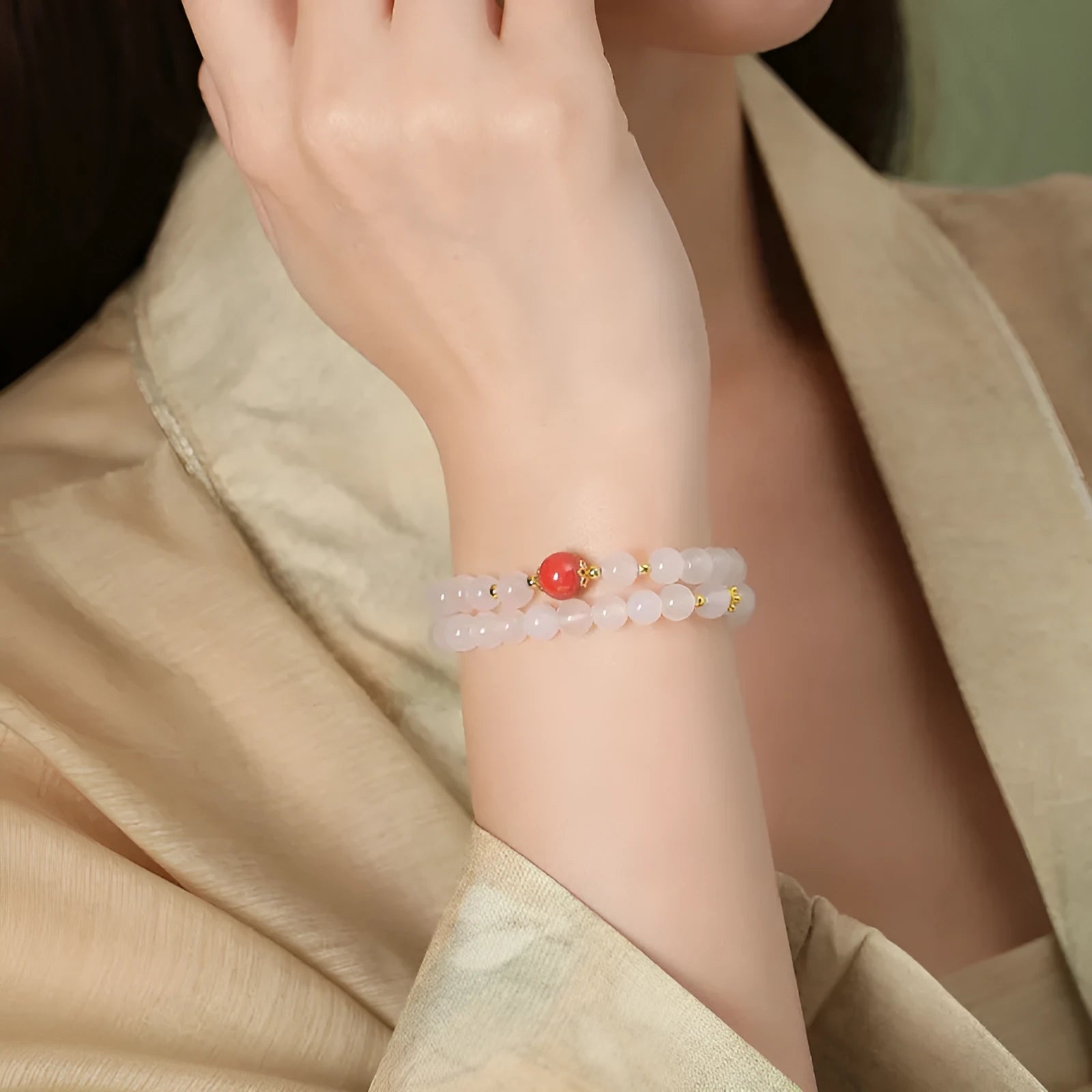 White agate women's bracelet with 6mm beads, geometric double-layer design and a jequirity bean cinnabar accent.