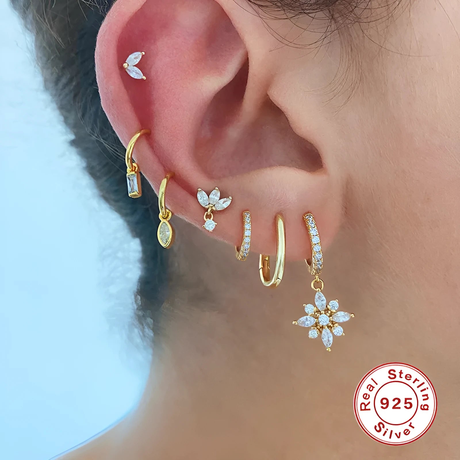 Sterling silver snowflake pendant earrings with geometric design and gemstone accents