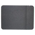 Black 2-in-1 wireless charging mouse pad on a desk with a phone resting on the built-in bracket