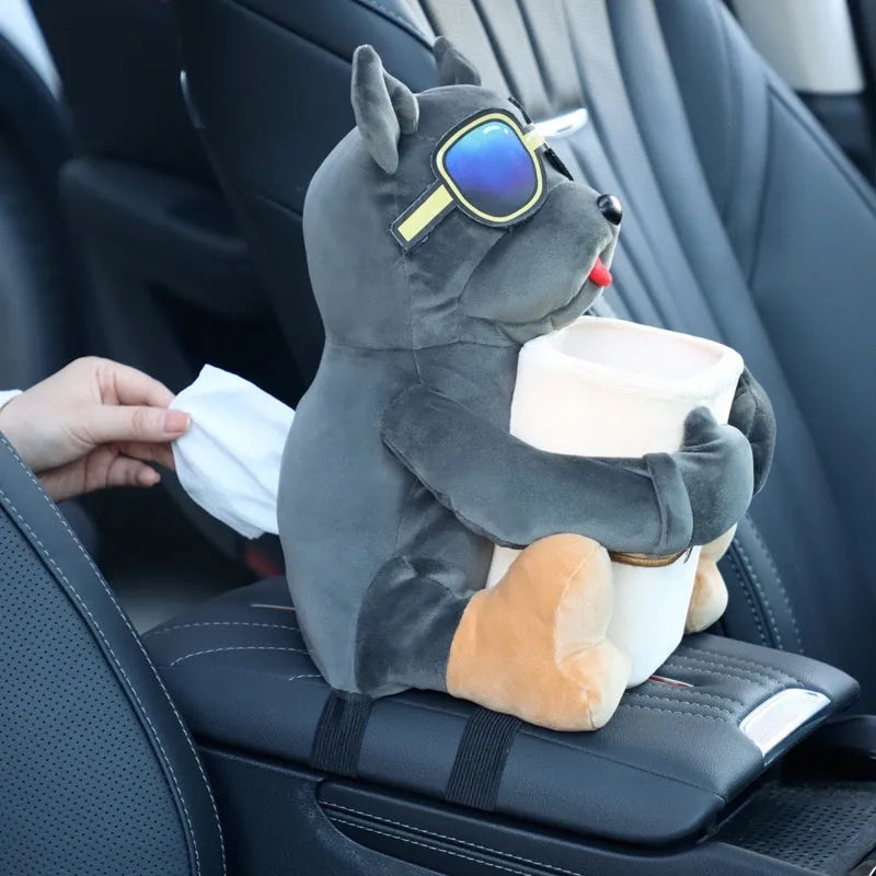 Plush car tissue box holder hanging in flip armrest compartment with dog character design