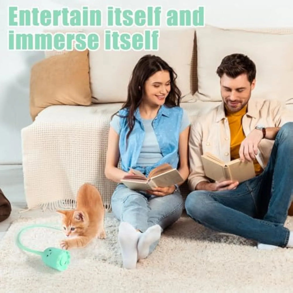Electronic cat toy with swinging green silicone tail on plastic base