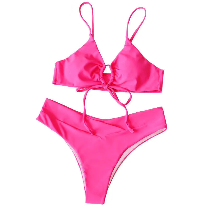 Women's bikini swimsuit with tied bow detail and split front design in solid colour