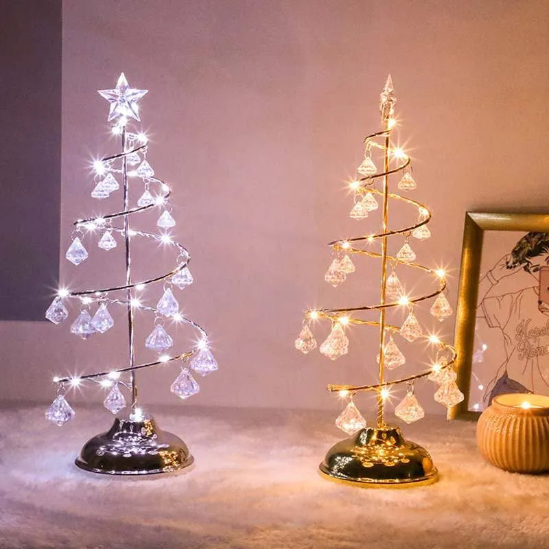 Gold crystal Christmas tree LED light with battery-powered warm glow on a shelf