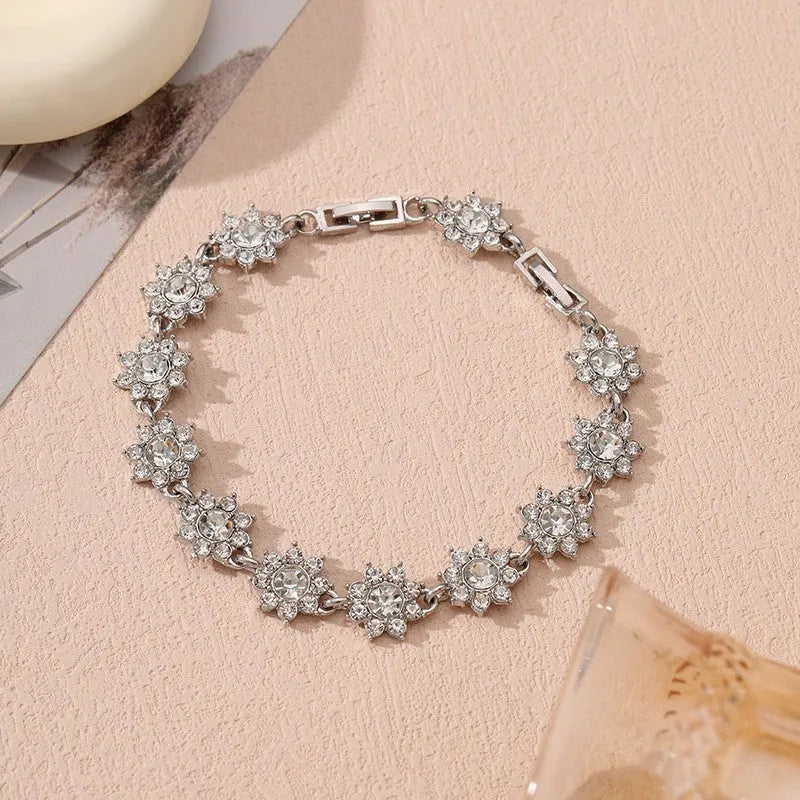 Luxury style bracelet with coloured gems and floral design on zinc alloy with electroplated finish
