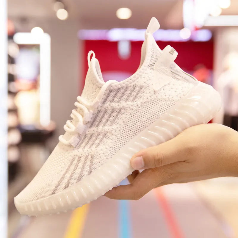 Men's white breathable sports shoes with mesh lining and a platform sole on a neutral background.