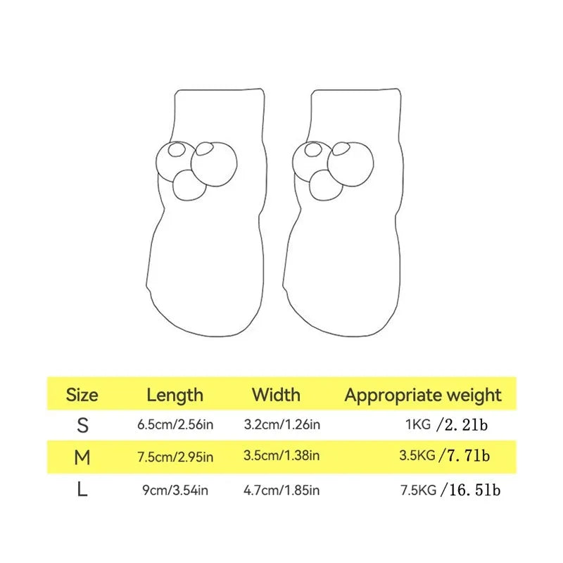 Dog wearing green non-slip socks with cartoon big eyes pattern on wooden floor