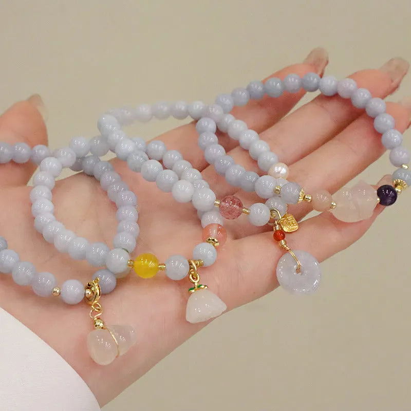 Women's handmade artificial crystal bracelet with gold-plated chain and charm pendant