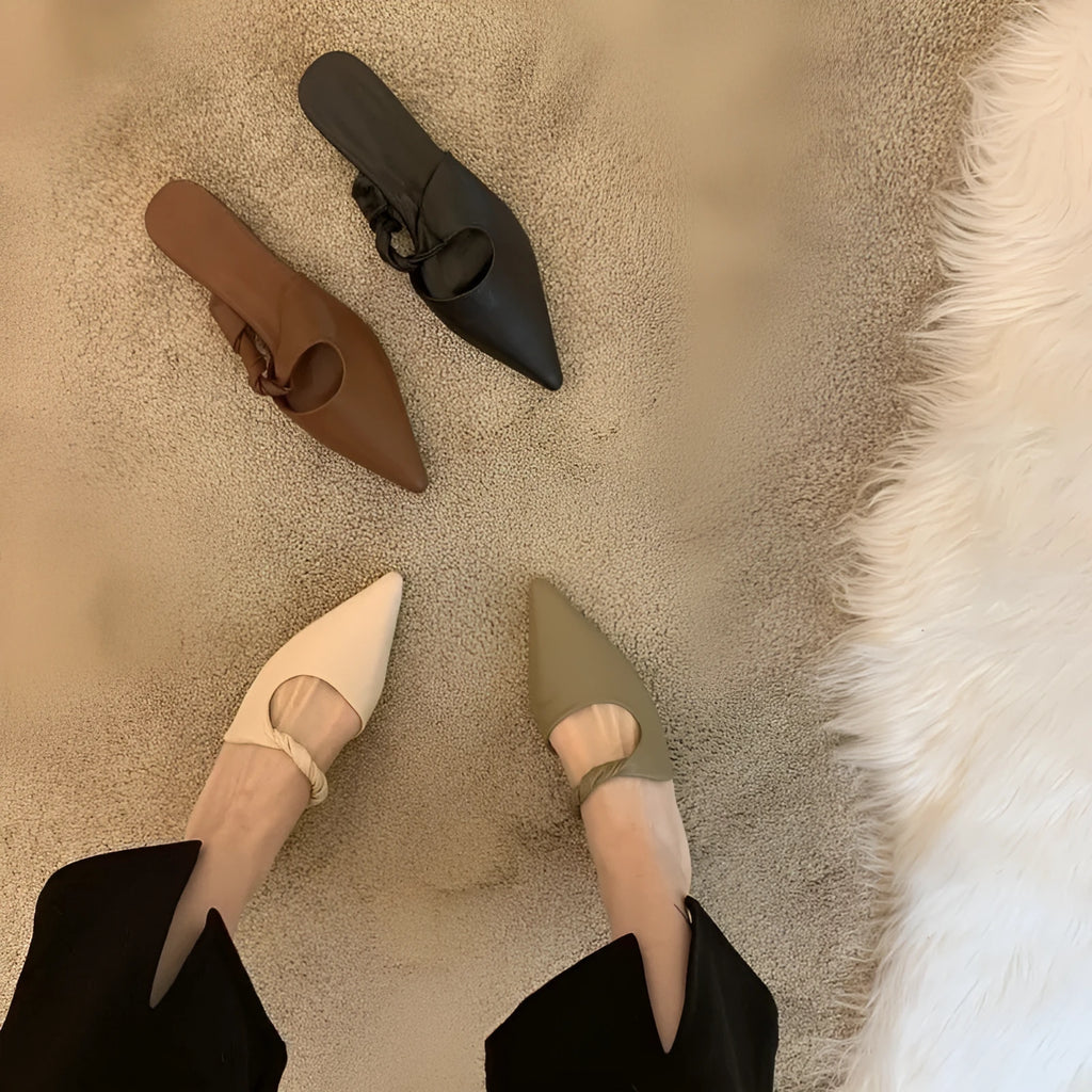 Women's soft leather slippers in dark brown with a semi-toe box design and rubber sole.
