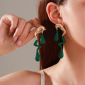 Liquid irregular geometric water drop ear studs in gold, zinc alloy with electroplated finish