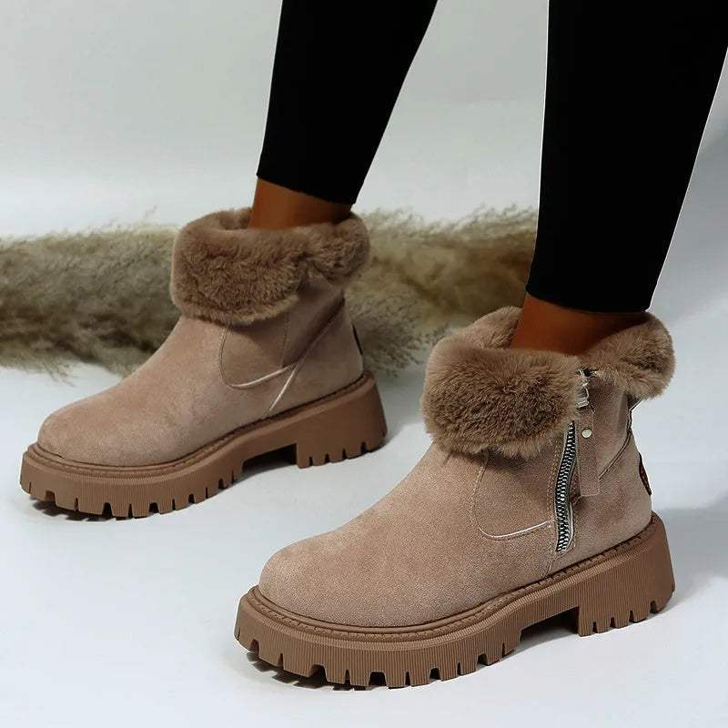 Women's black high-top snow boot with side zip, faux fur lining visible, and a rubber sole.