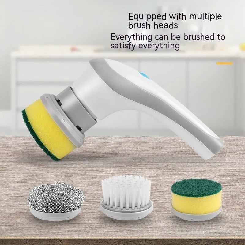 White cordless electric cleaning brush with multiple brush heads on storage bracket