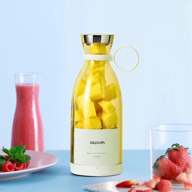 Handheld portable mini electric juicer in pink and white colours with USB charging cable