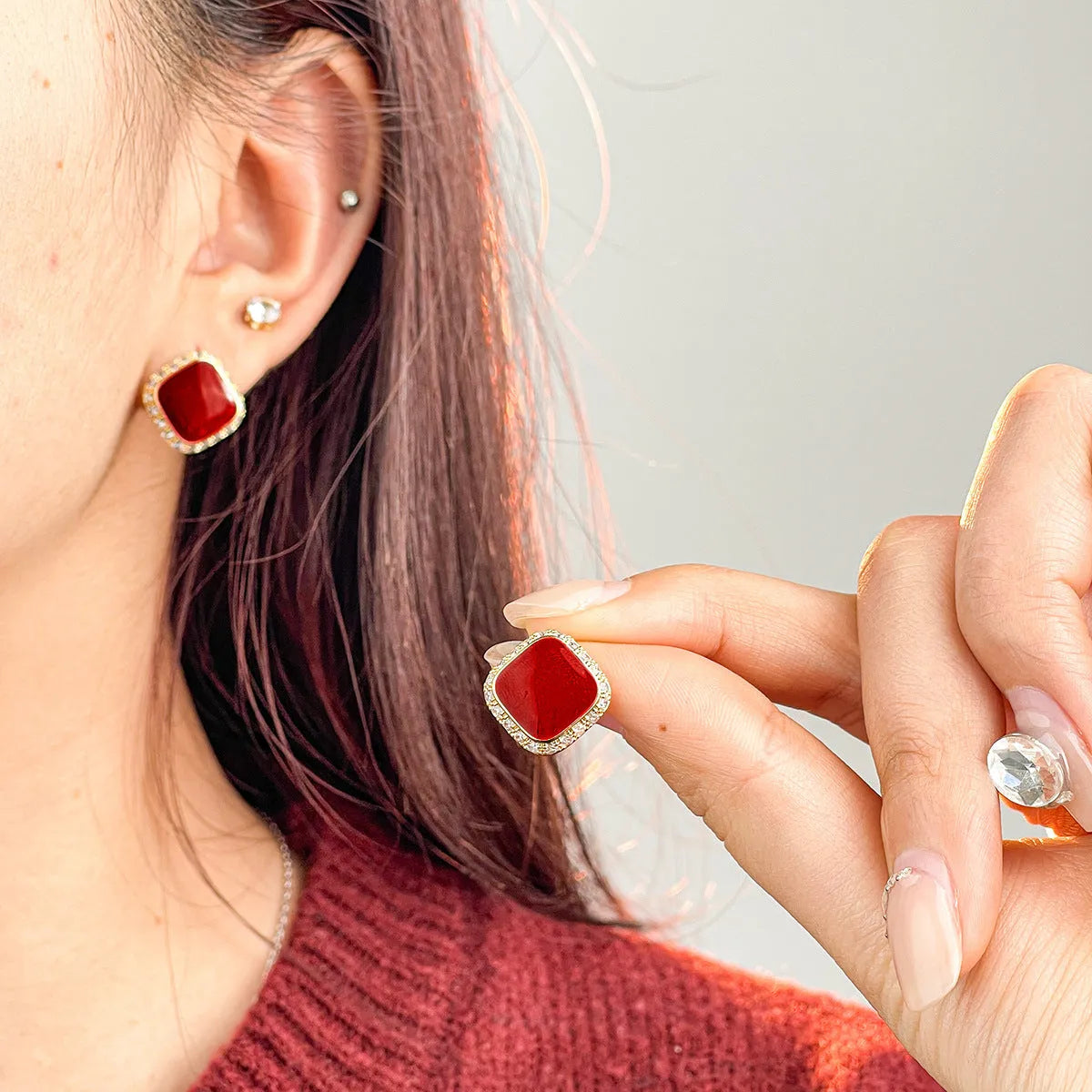 A pair of retro red square geometric alloy earrings with an inlaid design detail.