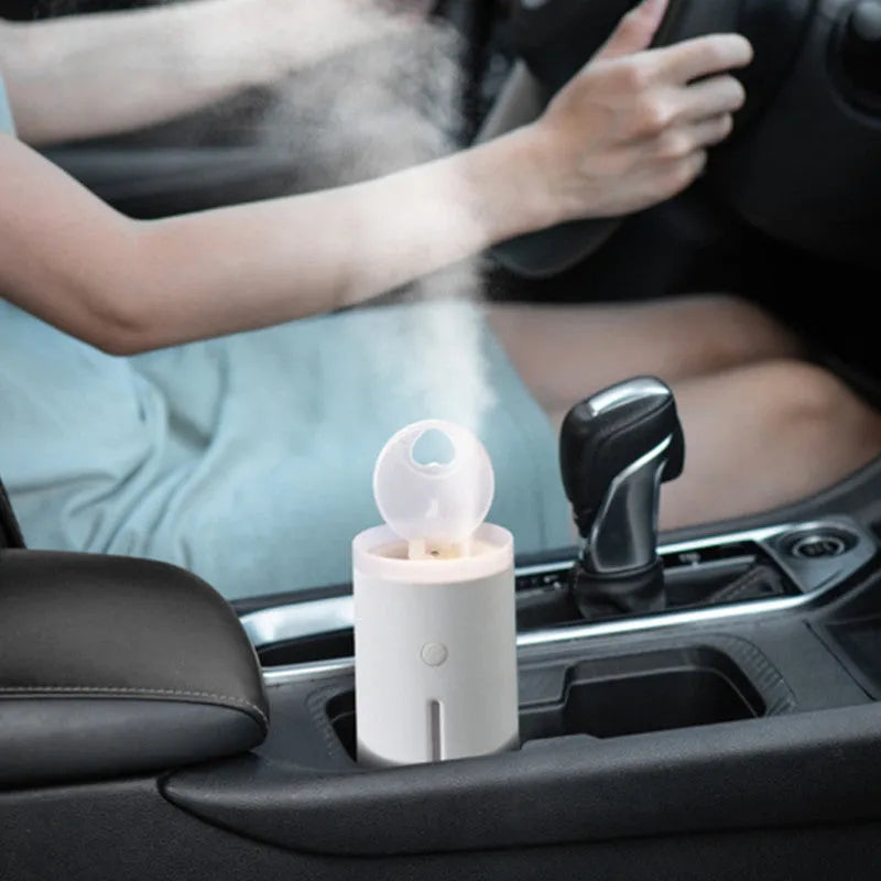 Spitting Circle humidifier in porcelain white with large fog output and dual atomisation modes for desktop use