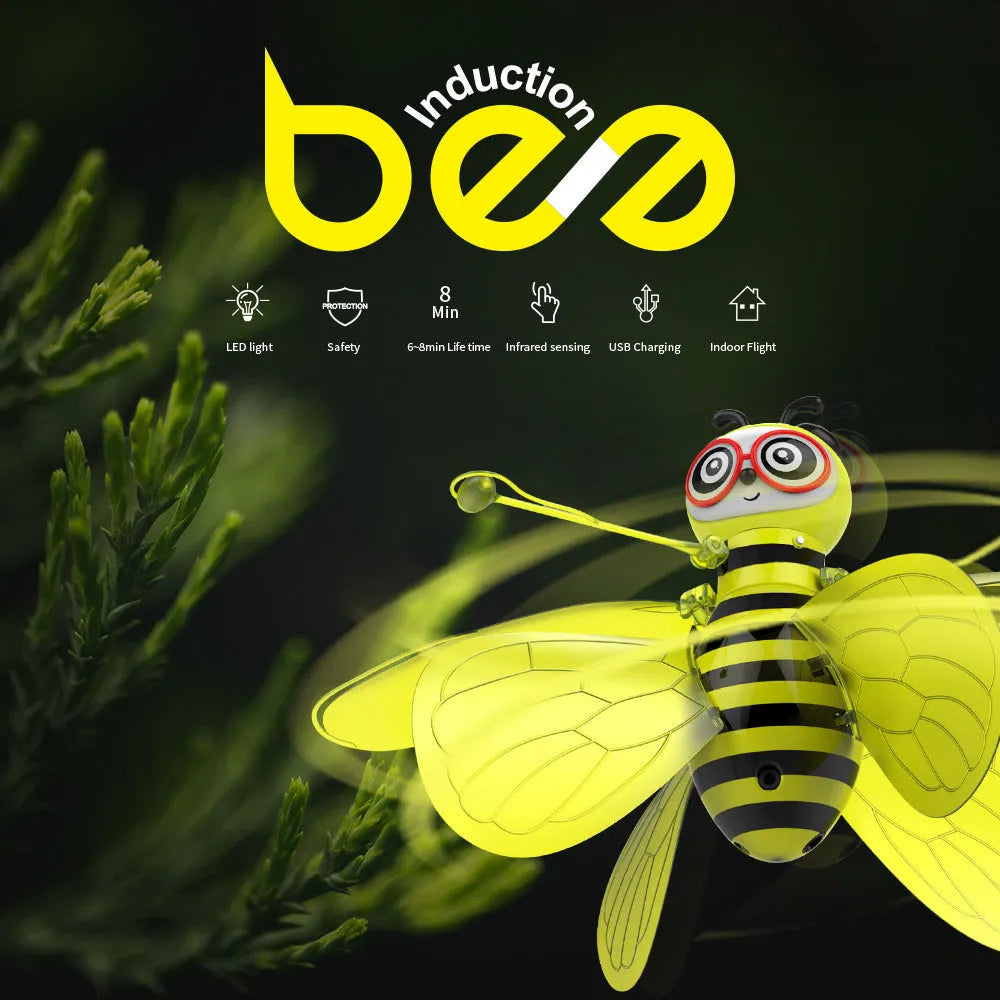 Yellow mini flying ball bee drone with infrared gesture sensing, ABS plastic body, and removable wings on a white background