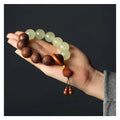 Rosewood bracelet with carved Fu character design in amass fortunes colour, showing 20mm size and flexible ring construction