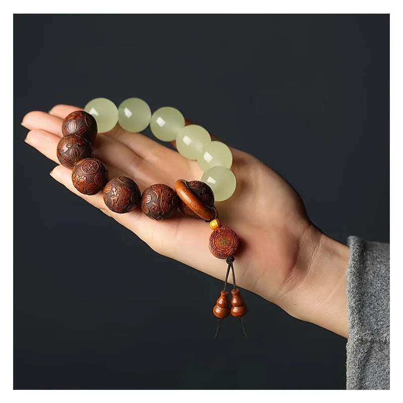 Rosewood bracelet with carved Fu character design in amass fortunes colour, showing 20mm size and flexible ring construction