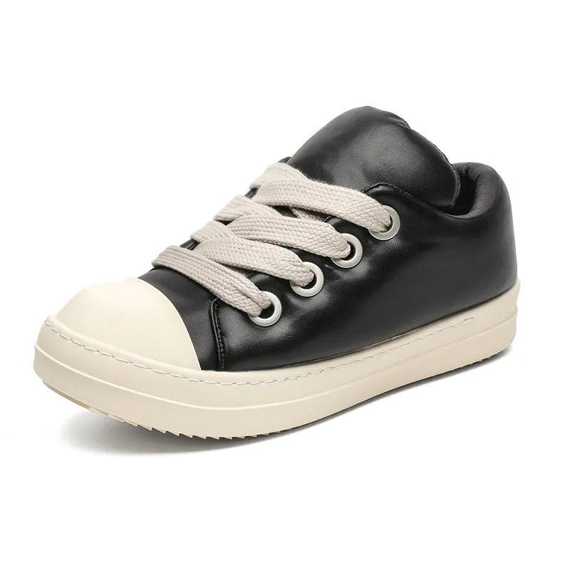 Men's black leather slip-on casual shoes with flat rubber sole and round toe on a white background.