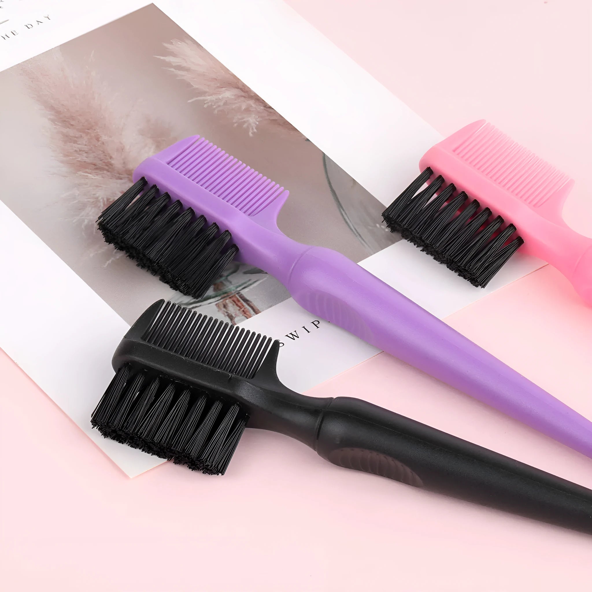 Double-headed steel needle eyebrow brush cleaner in black with plastic handle, over 20cm long
