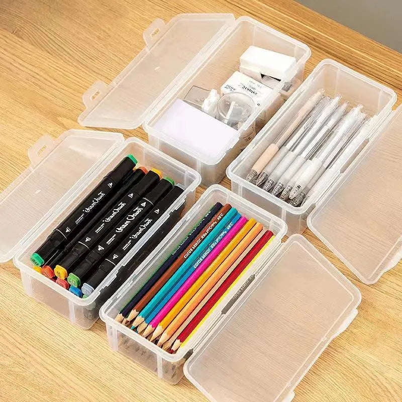 Transparent plastic pencil storage box for stationery organisation with visible drawing supplies inside