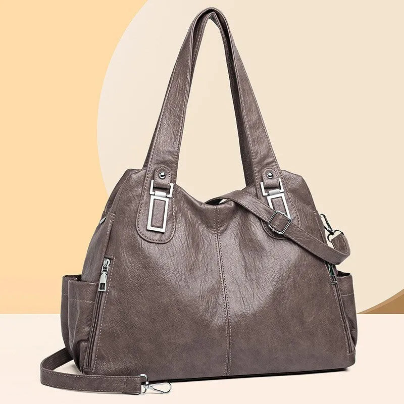 Square vertical women's tote bag in soft PU material with a single shoulder strap, shown in a light brown colour.
