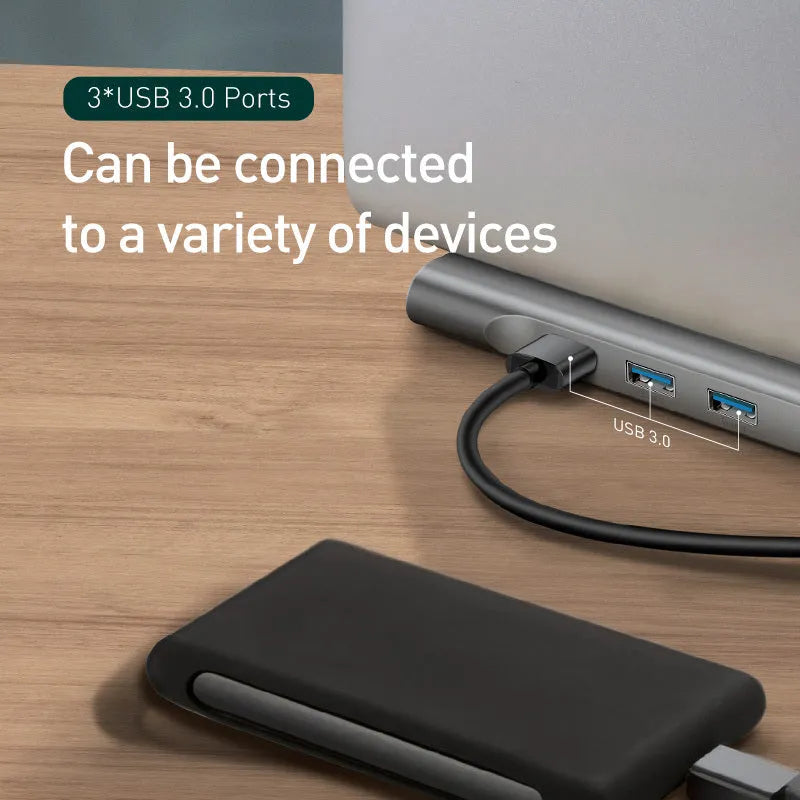 Grey aluminium docking station with cooling bracket showing ten ports including HDMI VGA and network connections