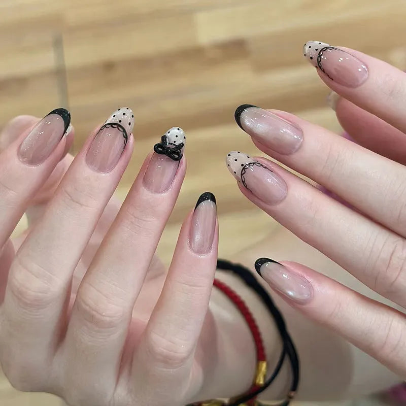 Medium length coffin-shaped fake nails in mixed colours with nail glue and application tools
