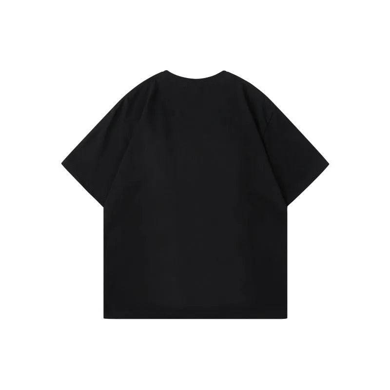 Men's loose fit grey T-shirt with a black and white patchwork letter design on the chest.