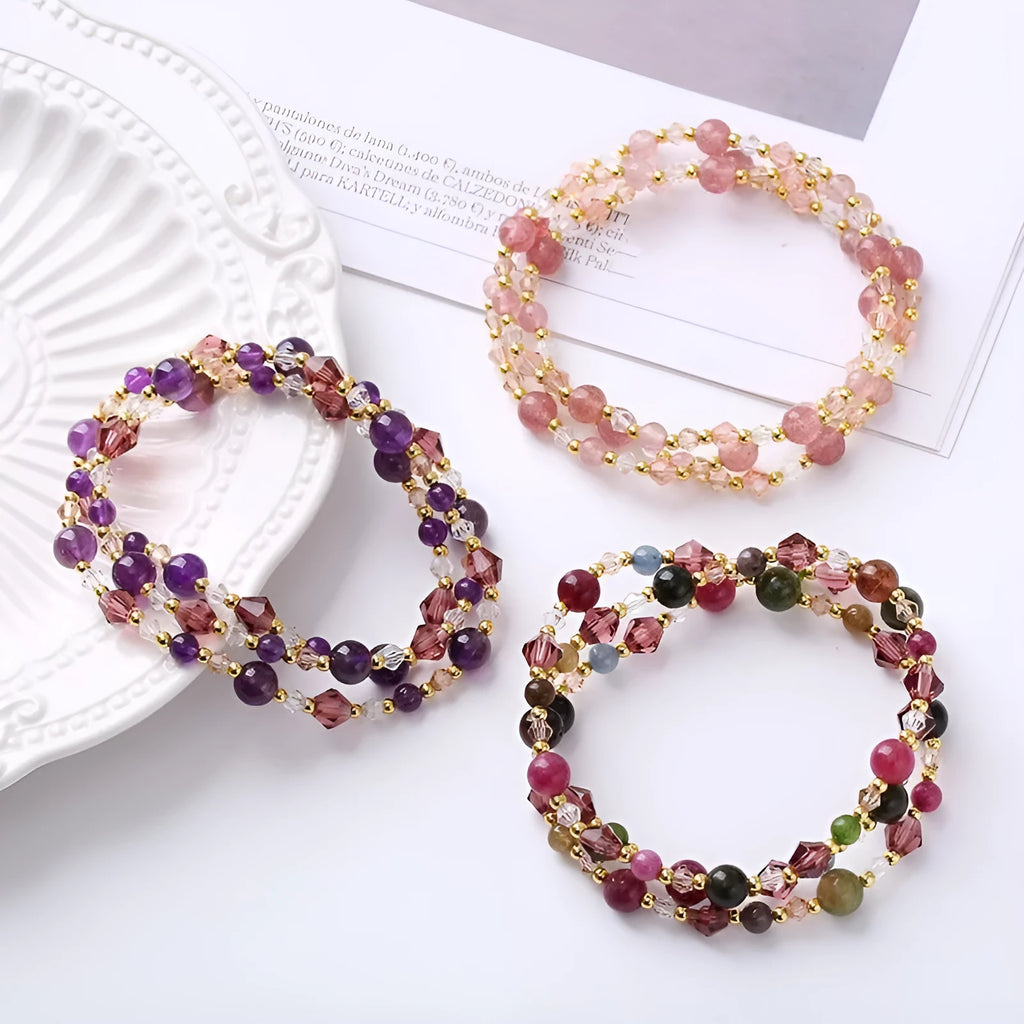 Women's three-ring crystal bracelet in tourmaline, strawberry quartz, or amethyst on an adjustable cord.