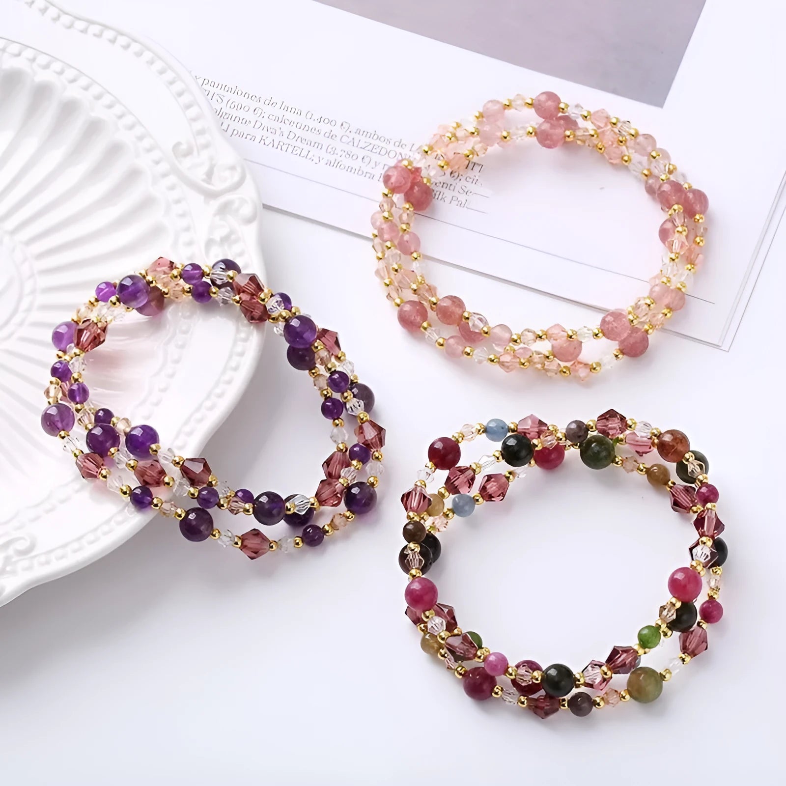 Women's three-ring crystal bracelet in tourmaline, strawberry quartz, or amethyst on an adjustable cord.