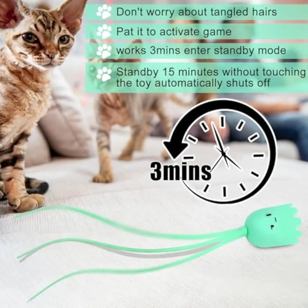 Electronic cat toy with swinging green silicone tail on plastic base