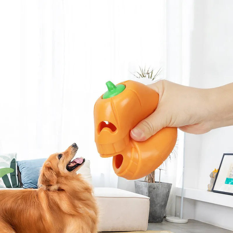 Halloween pumpkin shaped interactive dog chew toy with treat-dispensing funnel