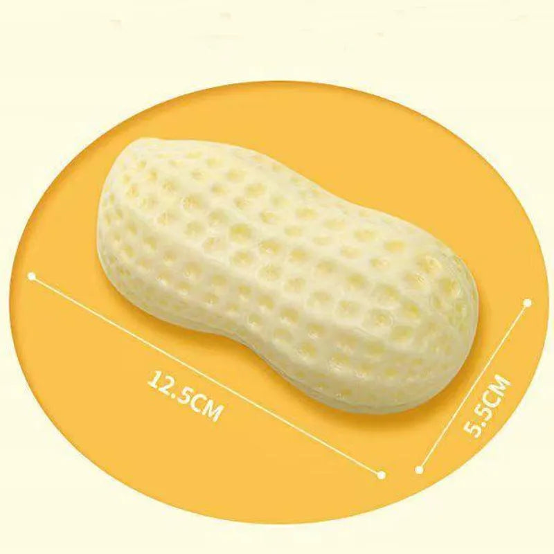 Yellow peanut-shaped dog chew toy with textured surface and squeaker for teeth cleaning and interactive play