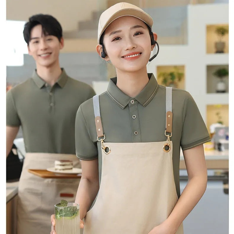 Short sleeve waiter work shirt in black polyester-acetate fabric with regular sleeves, front view on model.