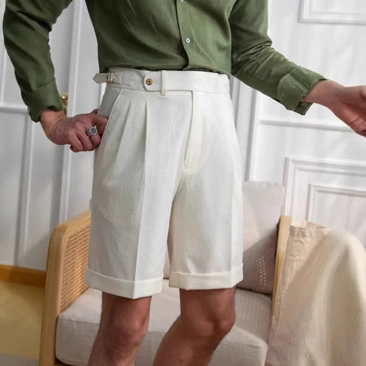 Men's straight-leg Neapolitan Kilge shorts in apricot colour on a hanger.