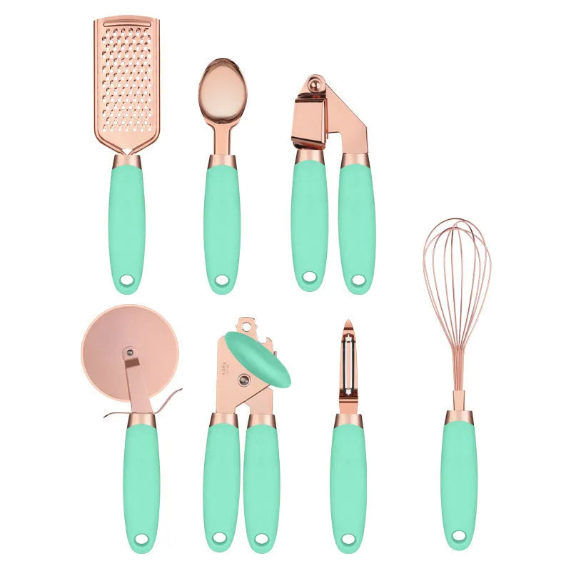 Seven-piece stainless steel kitchen tool set with copper plating on a matching storage rack.