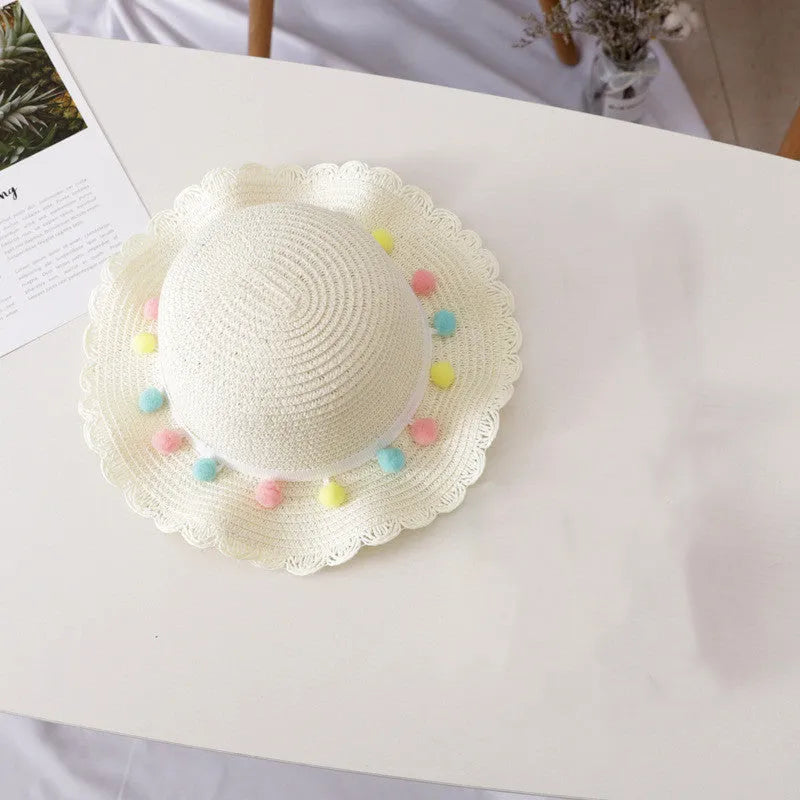 Children's straw hat and bag set in solid colour, large brim, dome top with cartoon pattern and hairy ball detail